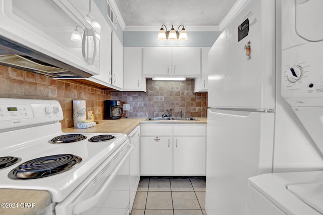 kitchen with white cabinetry, ornamental molding, sink, light tile patterned floors, and white appliances