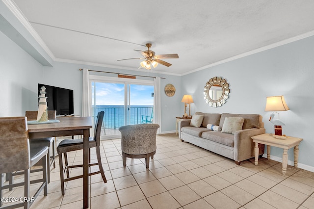 tiled living room with ceiling fan and crown molding