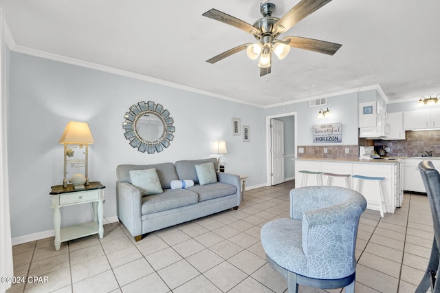 tiled living room with ceiling fan and ornamental molding