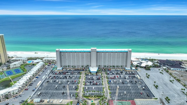 drone / aerial view with a water view and a view of the beach