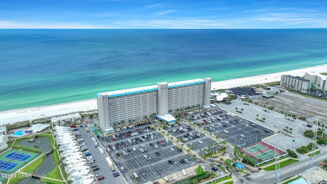 aerial view featuring a view of the beach and a water view