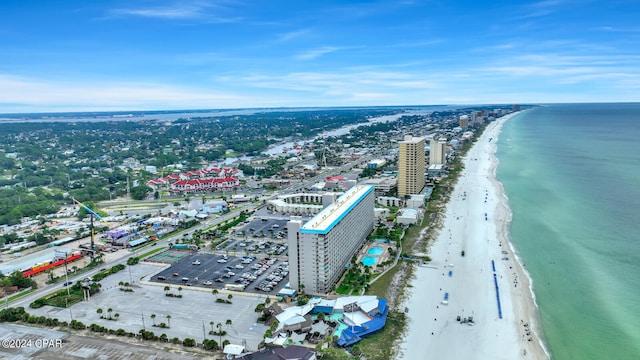 drone / aerial view with a beach view and a water view