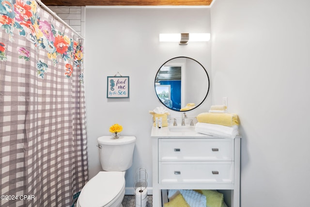 bathroom with toilet and vanity