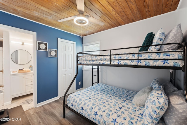 bedroom with hardwood / wood-style flooring, ensuite bathroom, wooden ceiling, and ceiling fan