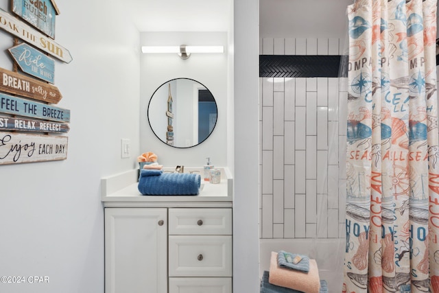 bathroom with shower / bathtub combination with curtain and vanity