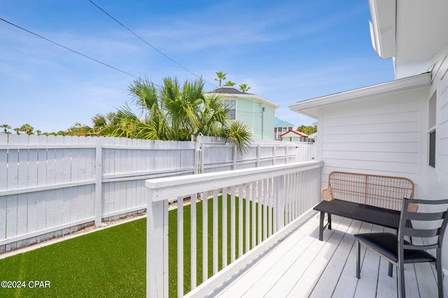 deck featuring a lawn