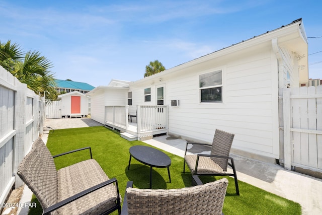 rear view of house featuring a lawn and a patio area