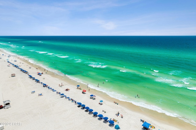 bird's eye view featuring a beach view and a water view