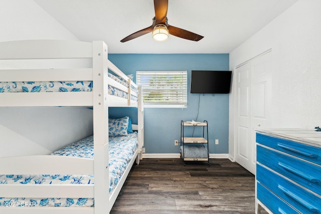 bedroom with ceiling fan, a closet, and dark hardwood / wood-style floors