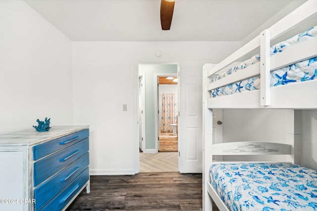 bedroom featuring ceiling fan and dark wood-type flooring