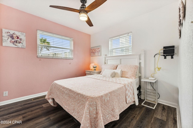 bedroom with ceiling fan and dark hardwood / wood-style floors