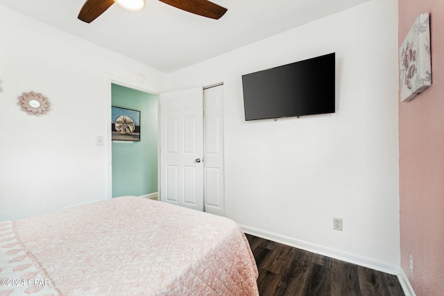 bedroom with ceiling fan, hardwood / wood-style flooring, and a closet