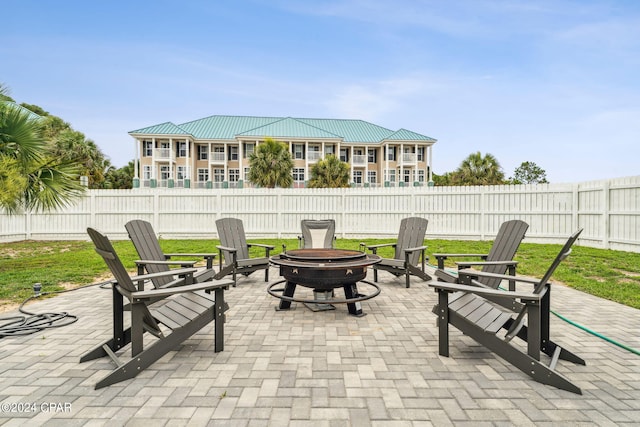 view of patio / terrace featuring a fire pit