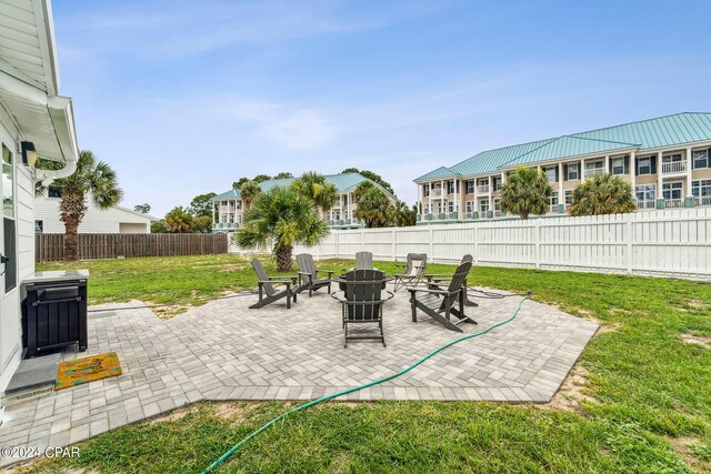 view of yard featuring a fire pit and a patio area