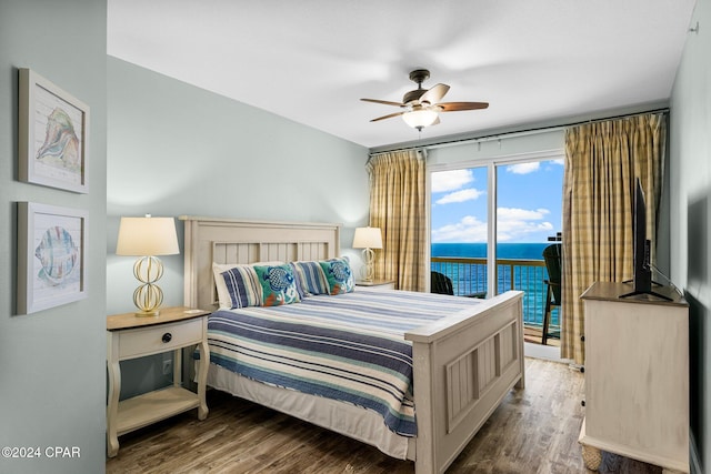 bedroom featuring access to outside, ceiling fan, and dark wood-type flooring