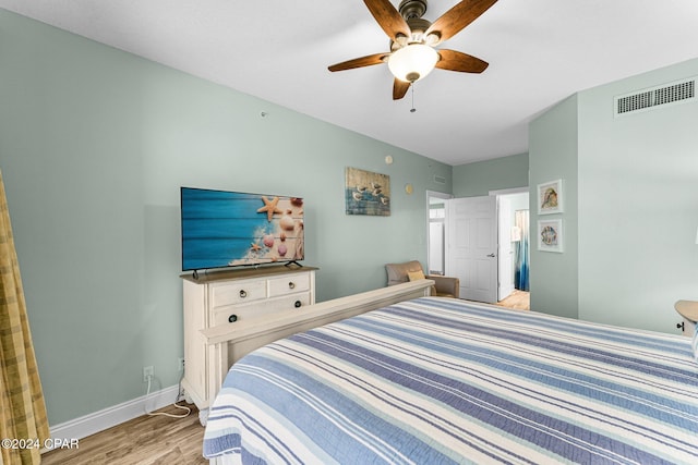 bedroom with ceiling fan and light wood-type flooring