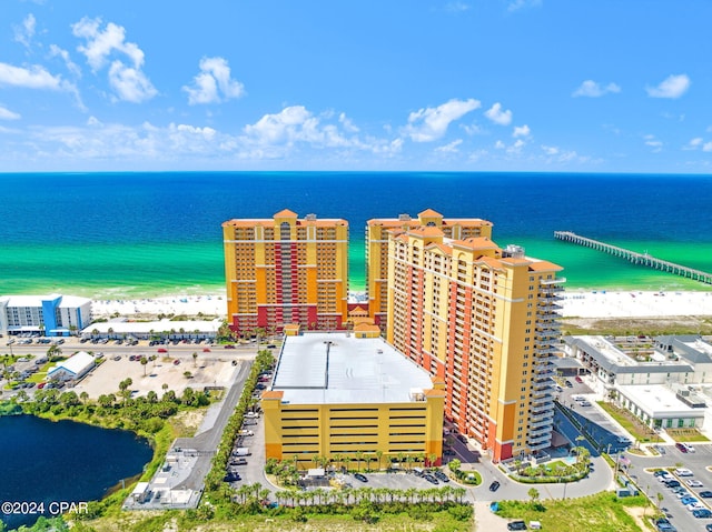 birds eye view of property featuring a view of the beach and a water view