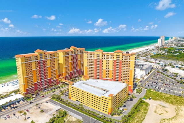 bird's eye view featuring a water view and a view of the beach