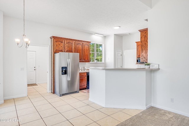 kitchen with kitchen peninsula, an inviting chandelier, light tile patterned floors, and stainless steel refrigerator with ice dispenser