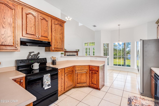 kitchen featuring an inviting chandelier, black appliances, pendant lighting, light tile patterned floors, and kitchen peninsula