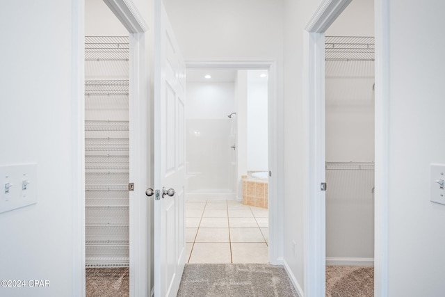 hallway with light tile patterned flooring