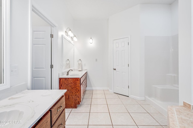 bathroom with tile patterned flooring and vanity