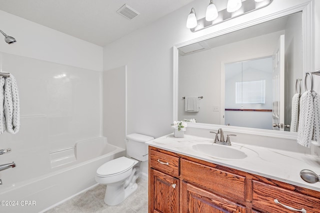 full bathroom featuring tile patterned floors, shower / washtub combination, vanity, and toilet