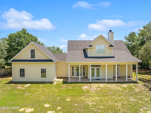 view of front of property with a patio area and a front yard