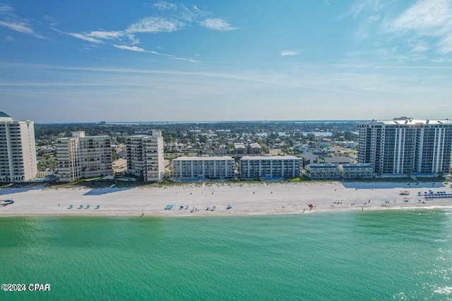 birds eye view of property featuring a view of the beach and a water view