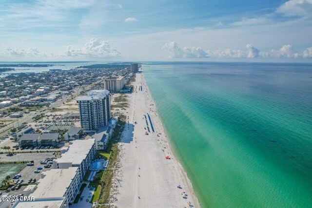 aerial view with a water view and a view of the beach