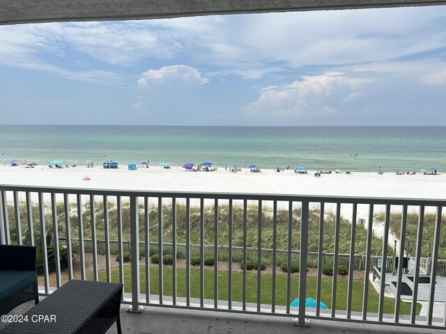 balcony with a view of the beach and a water view