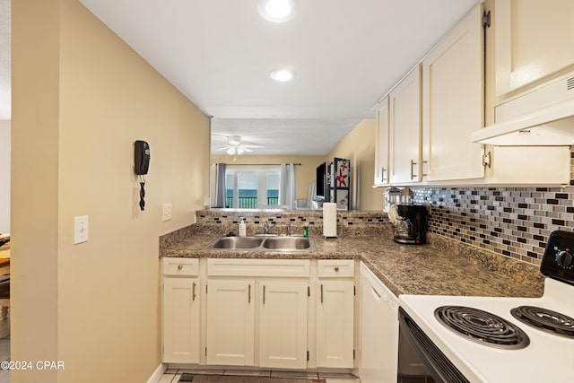 kitchen featuring sink, tasteful backsplash, stove, and ceiling fan