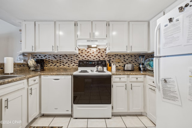 kitchen featuring light tile patterned flooring, white cabinets, and white appliances