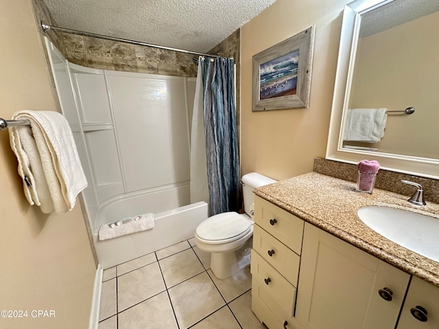 full bathroom featuring shower / tub combo with curtain, vanity, tile patterned floors, toilet, and a textured ceiling