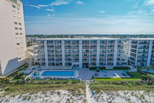 view of building exterior with a community pool