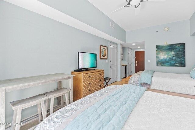 bedroom with ceiling fan and light hardwood / wood-style floors