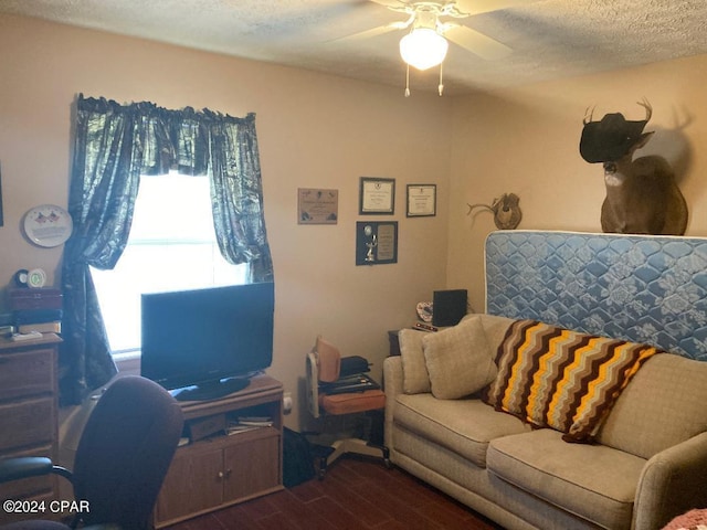 office space featuring a textured ceiling, ceiling fan, and dark wood-type flooring