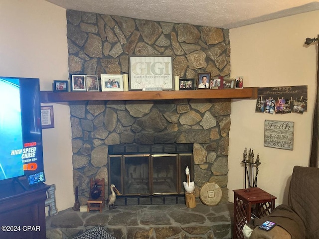 details with a fireplace and a textured ceiling