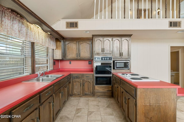 kitchen featuring sink, appliances with stainless steel finishes, and light tile patterned floors