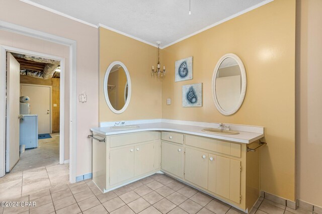 bathroom with tile patterned flooring, a textured ceiling, dual bowl vanity, and ornamental molding