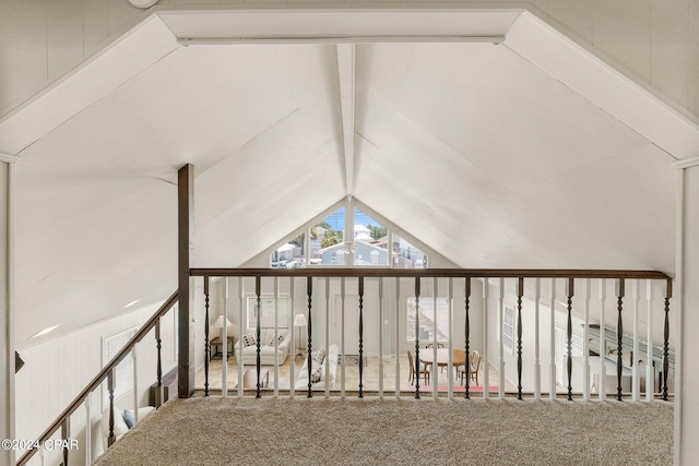 additional living space with carpet floors and lofted ceiling