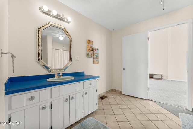 bathroom with vanity, ceiling fan, and tile patterned flooring