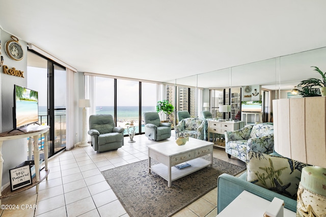 living room featuring light tile patterned floors and expansive windows