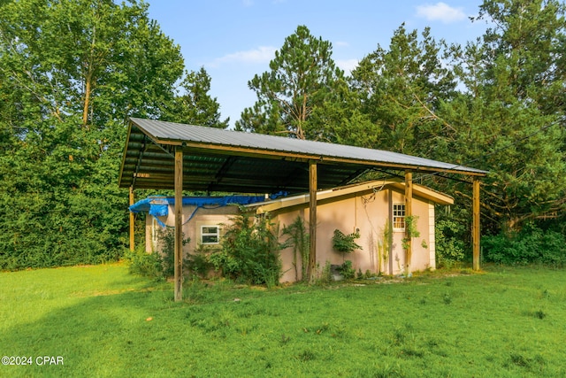 view of outbuilding with a lawn