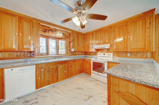 kitchen with white appliances, light tile patterned floors, ceiling fan, sink, and light stone counters