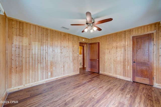 unfurnished bedroom with hardwood / wood-style floors and ceiling fan