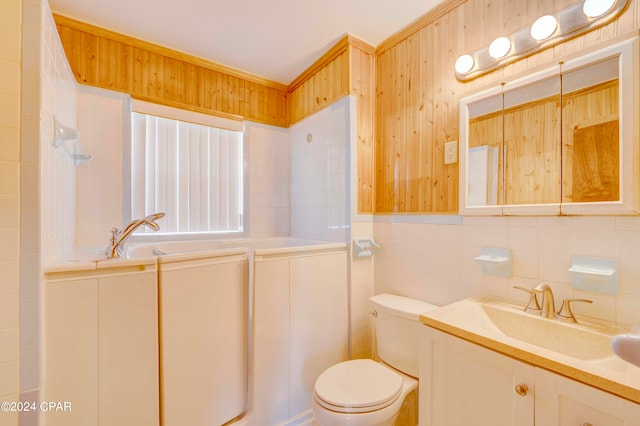 bathroom featuring tile walls, backsplash, toilet, and vanity