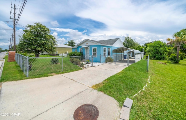 bungalow-style house with a carport and a front lawn