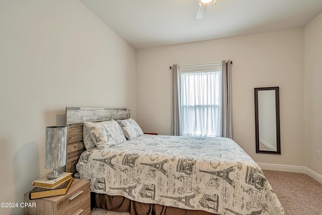 bedroom featuring ceiling fan and carpet