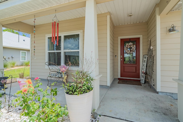 doorway to property featuring a porch